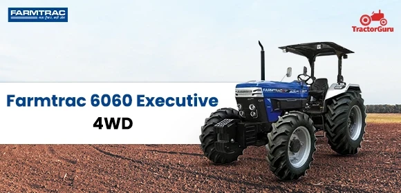 Blue Farmtrac 6060 Executive 4WD tractor in a field