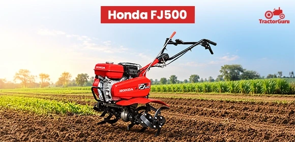 Honda FJ500 power tiller resting on a tilled farm field.